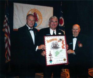 John D. Clark, Sr. accepts the Executive Order of the Ohio Commodore from Ohio Governor Ted Strickland (left) and Grand Commodore William Morgan (right.)